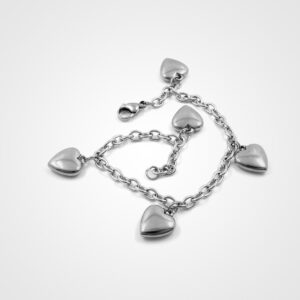Silver heart charm bracelet with five heart pendants on a delicate chain, perfect for bridal accessories and wedding day jewelry.