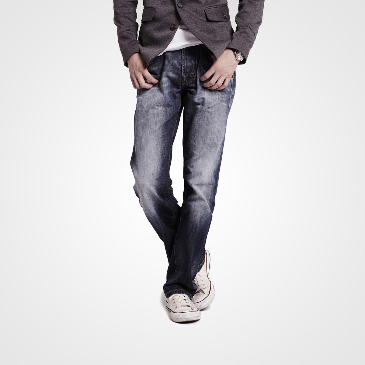 Stylish men's casual outfit featuring denim jeans, blazer, and sneakers, suitable for wedding guests and semi-formal occasions.