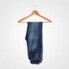 Pair of stylish blue denim jeans hanging on a wooden hanger, perfect for casual or semi-formal wear. Ideal for fashion-forward brides or bridal party accessories.