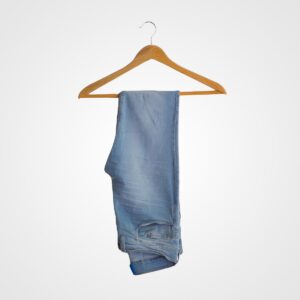 Pair of casual blue jeans hanging on a wooden hanger against a plain white background, showcasing everyday denim wear.