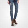 Stylish distressed denim jeans paired with brown ankle boots, perfect for casual or semi-formal occasions.