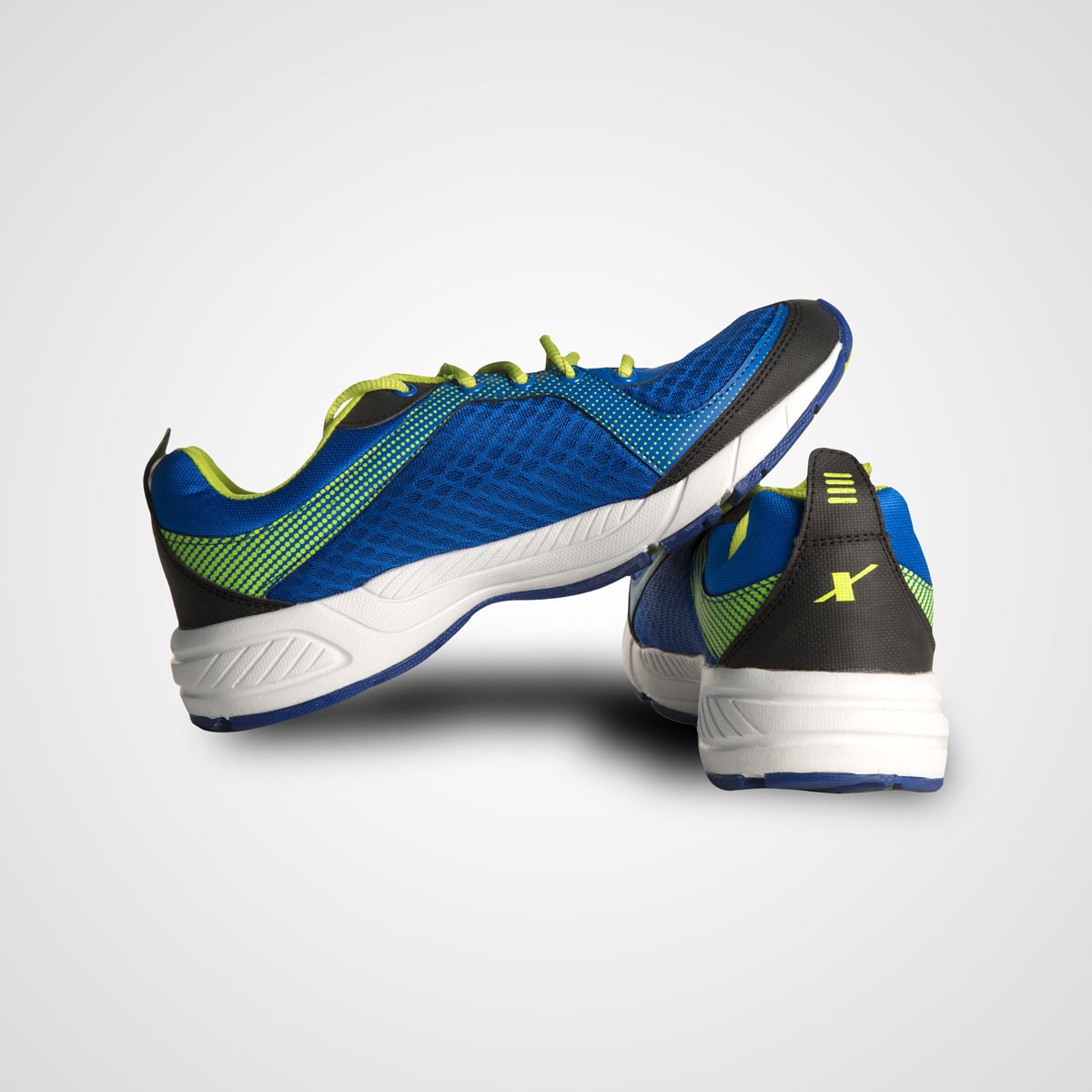Blue and green athletic running shoes for men with breathable mesh upper and cushioned sole, ideal for sports and active lifestyles.