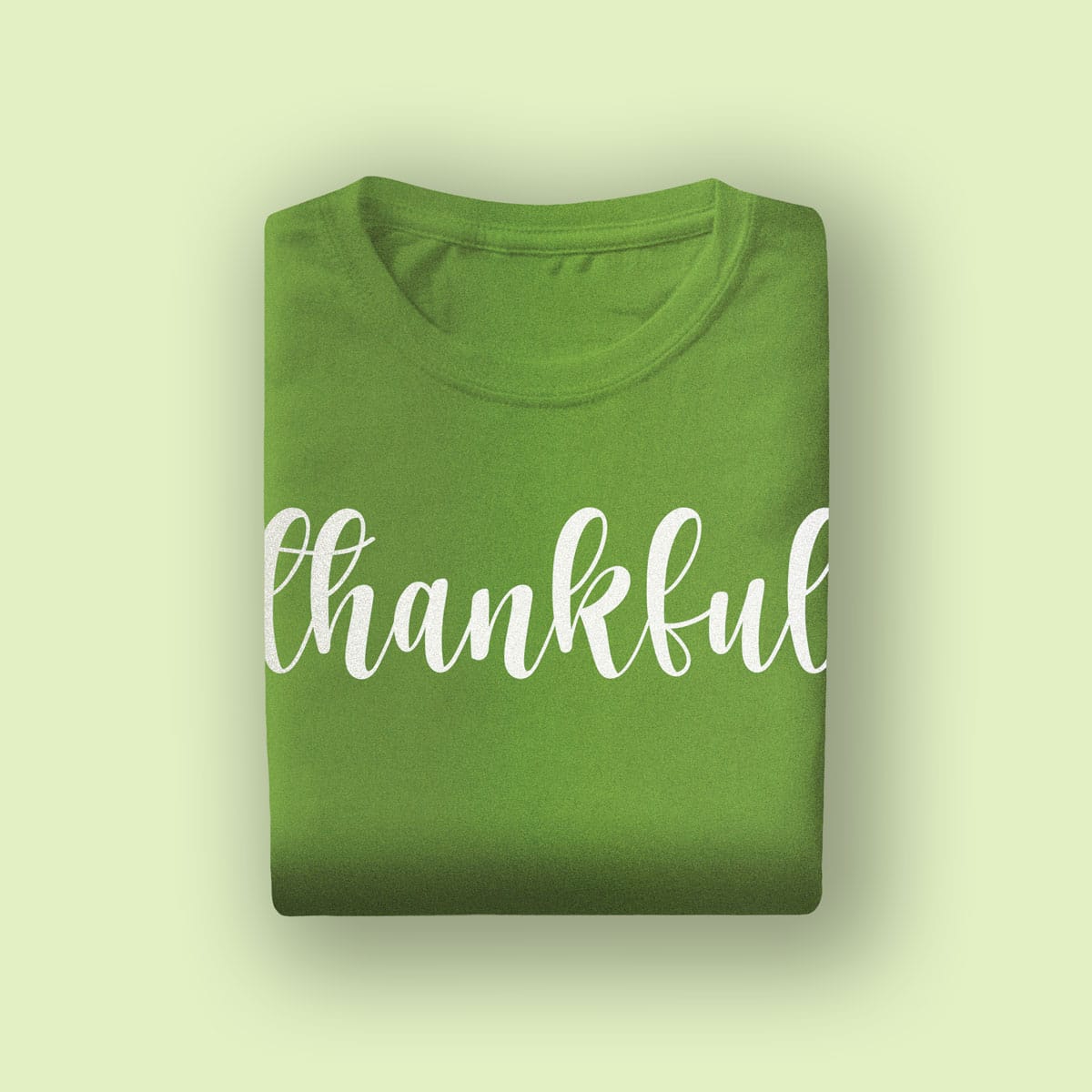 Green "thankful" T-shirt, ideal for bridal parties, wedding events, or casual occasions celebrating gratitude and positivity.