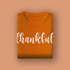 Orange "thankful" T-shirt, perfect for bridal celebrations and wedding events, showcasing gratitude and joy for brides and wedding parties.