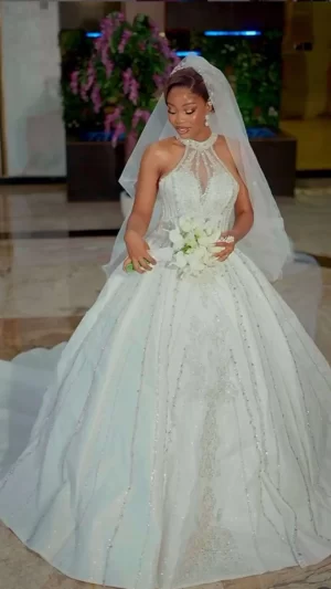 Uju halter neck luxury wedding gown featuring a sleek silhouette and elegant neckline, available at Yes I Do Bridal Lekki, Lagos, Nigeria