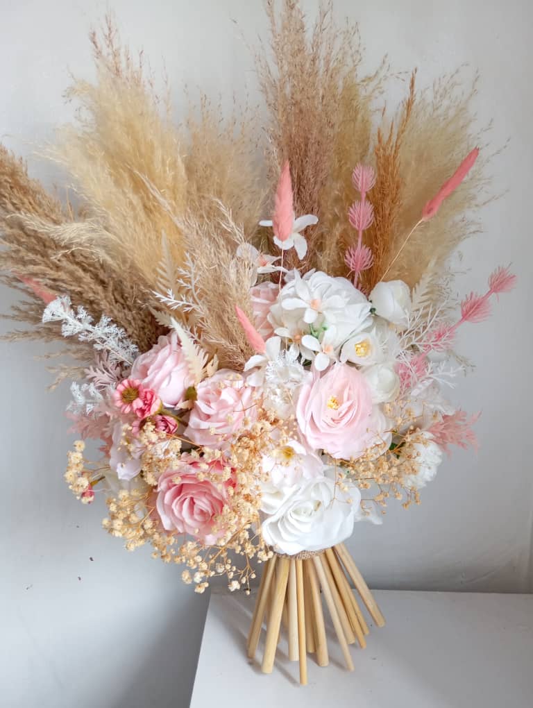 Pink and white billy ball boutonnieres to rustic sunflowers, scabiosa, larkspur, amaranthus and asters flowers that have been hand picked and gathered together by our floral experts for just the theme bride bouquet, Blooms and greens.